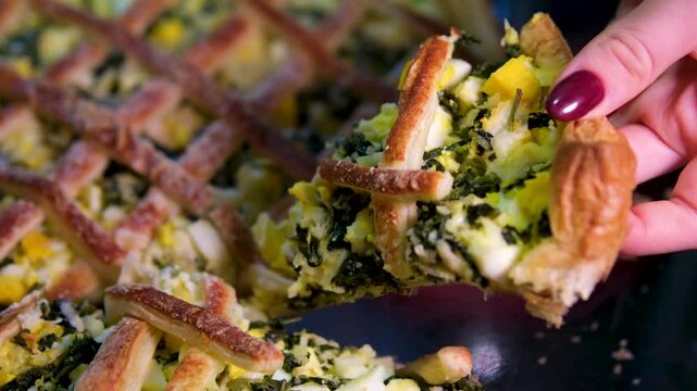 spinach pie Classic Quiche with spinach. Fish tart. Open faced salmon quiche on kitchen table with broccoli pieces and savory pie on background.