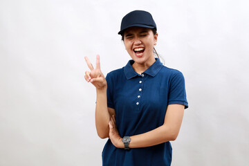 Young hispanic woman courier wearing delivery uniform and cap smiling with happy face winking at the camera doing victory sign. number two.
