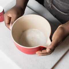 Top view of a red ceramic mixing bowl with pouring spout, Flat lay of ceramic batter bowl for mixing ingredients