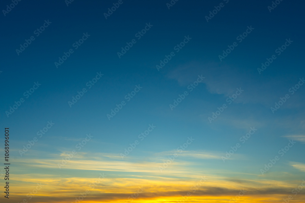 Wall mural blue sky with colorful cirrus clouds at sunset. abstract texture background.
