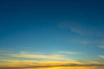 Fototapeta premium Blue Sky with Colorful Cirrus Clouds at Sunset. Abstract Texture Background.