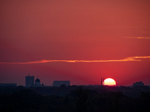 sunset over Bucharest, Romania, with a beautiful red sky
