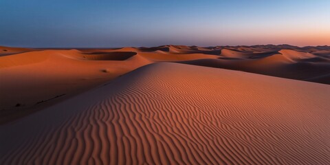 Naklejka premium Sonnenuntergangsfarben über Sanddünen in der Wüste
