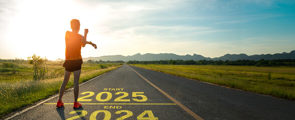 New year 2025 or start straight concept.word 2025 written on the asphalt road and athlete woman...