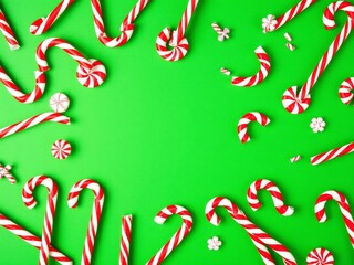 Peppermint candies scattered on a vibrant red background, sweets, treat