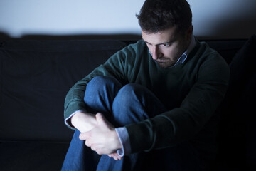 Man depressed  lying on the couch