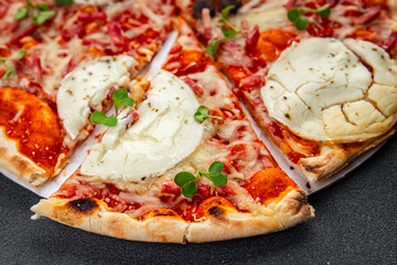 Pizza goat cheese, tomato sauce, bacon tasty food dish fresh delicious gourmet food background on...