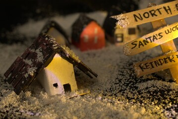 Miniature house in magical forest scenery