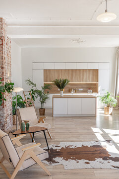 Bright and spacious living area featuring modern furniture and natural light in a stylish apartment in soft warm colors