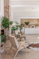 Bright and spacious living area featuring modern furniture and natural light in a stylish apartment in soft warm colors