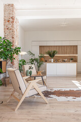 Bright and spacious living area featuring modern furniture and natural light in a stylish apartment in soft warm colors