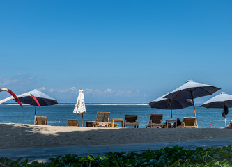 Relax Oceanside Lounge Chairs and Umbrellas