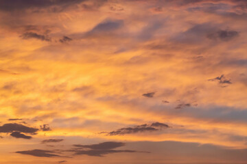 Golden hour sky with vibrant sunset clouds, perfect for backgrounds or wallpapers