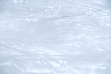 Obraz premium White plastic bag texture background. Close-up crumpled plastic texture with concepts of wrinkle texture, detail, clear, abstract for wallpaper. Texture background of a white crumpled plastic bag.