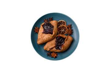 Sweet rye pies with cherries and chocolate
