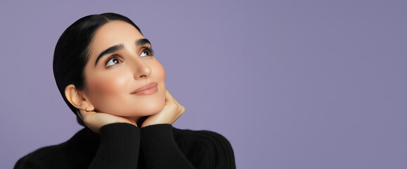 Portrait of an Arab woman looking up, isolated