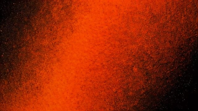 This video frame presents a vibrant, glowing orange texture evoking warmth and energy through dynamic abstract visuals.
