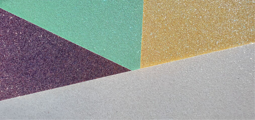 Fototapeta premium Shiny glitter background with sparkles. Brilliant abstraction. Purple, yellow, green and white. Shiny paper. Shiny multicolored wallpaper texture, interior design. Parts and segments.
