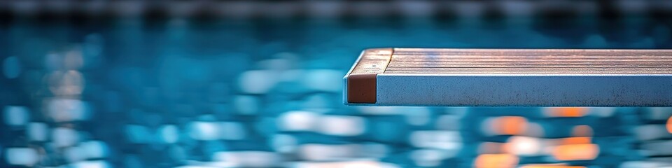 Close-up of springboard over clear swimming pool water
