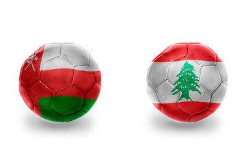 football balls with national flags of lebanon and oman ,soccer teams. on the white background.