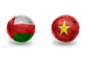 football balls with national flags of oman and vietnam ,soccer teams. on the white background.