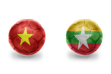 Obraz premium football balls with national flags of myanmar and vietnam ,soccer teams. on the white background.
