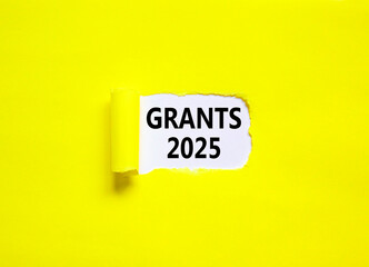 Planning grants 2025 new year symbol. Concept words Grants 2025 on beautiful white paper. Beautiful yellow paper background. Business grants 2025 new year concept. Copy space.
