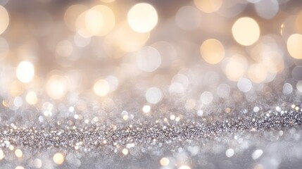 A shimmering silver and gold background with blurred bokeh lights, ideal for festive designs.