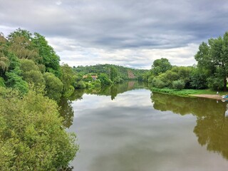 Fototapeta premium River through a forest