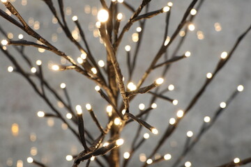 A beautiful display of twinkling lights on decorative branches, creating a mesmerizing ambiance