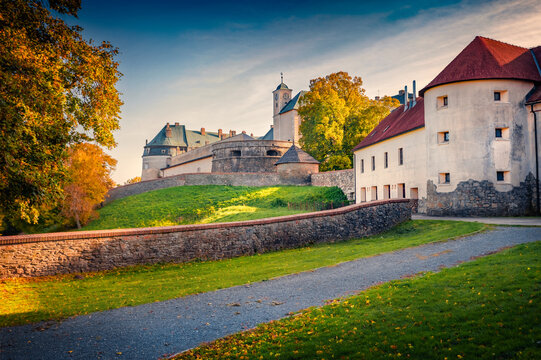 Majestic autumn voew of Red Stone Castle (Cerveny Kamen Castle). Amazing evening cityscape of P&iacute;la village, Slovakia, Europe. Traveling concept background..