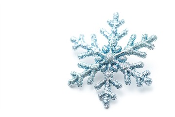 Blue glittery snowflake on white background