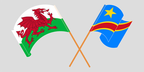 Crossed and waving flags of Wales and Democratic Republic of the Congo. Vector illustration