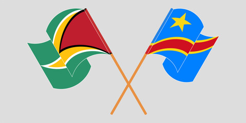 Crossed and waving flags of Guyana and Democratic Republic of the Congo. Vector illustration