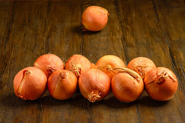 Whole Onions on Rustic Wooden Table