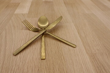 An Elegant Gold Cutlery Arrangement Perfectly Designed for Stylish and Modern Dining Spaces