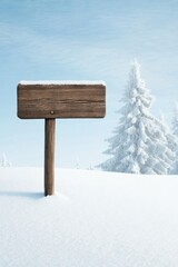 Snowy winter landscape with a wooden sign post