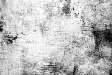 Close-up of a weathered concrete wall texture in grunge black and white tones.