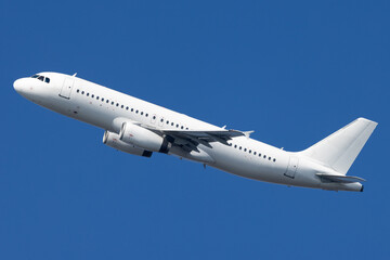 White airplane departing airport.
