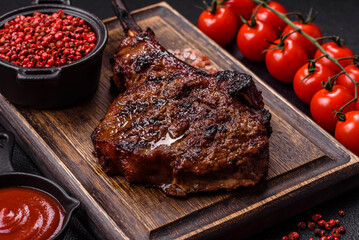 Grilled wagyu beef tomahawk steak with salt, spices and herbs