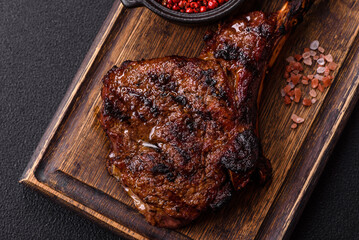 Grilled wagyu beef tomahawk steak with salt, spices and herbs