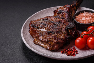 Grilled wagyu beef tomahawk steak with salt, spices and herbs