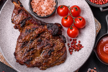 Grilled wagyu beef tomahawk steak with salt, spices and herbs