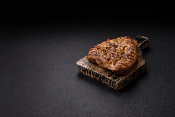 Grilled beef or pork steak with salt, spices and herbs