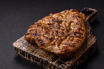 Grilled beef or pork steak with salt, spices and herbs