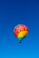 Kubicek Balloon Floating in Clear Blue Sky