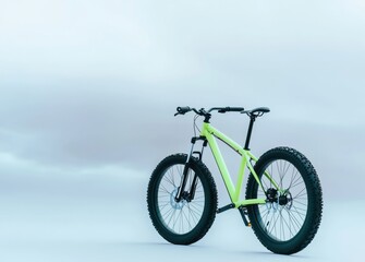 Vibrant green mountain bike against a misty background