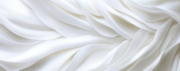 Obraz premium A soft, flowing texture of white fabric, showcasing delicate waves and an elegant appearance.