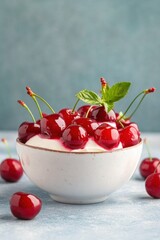 Delicious fresh red cherries in a white ceramic bowl