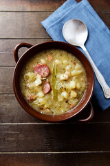 Cabbage soup on wooden background. Top view.